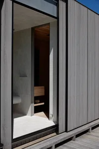 Modern interior space with minimalist design features wood paneling and a sleek contemporary look.