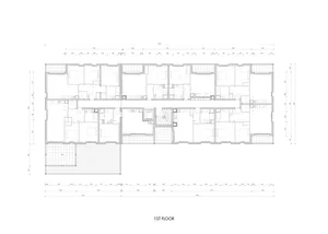 2D blueprint of the 1ST FLOOR of a building, showing architectural layout and design.