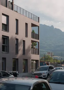 Modern apartment buildings with a concrete and metal facade.