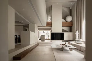 A minimalist living room with concrete texture flooring and large, open space.