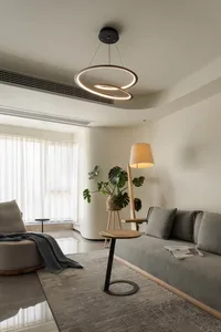 A minimalist living room featuring neutral-toned furniture and decor.