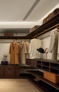 Modern interior with a luxury closet featuring wood shelves and hanging organizers.