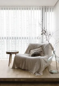 A modern minimalist living room with neutral tones