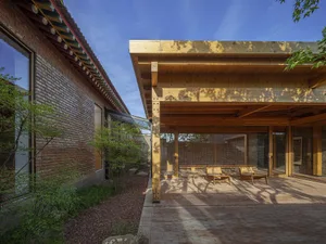 A modern patio featuring wooden elements.