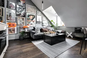 Industrial living room with metal furniture, wooden flooring, and fabric accents