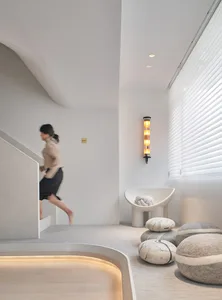 Modern minimalist interior design featuring concrete and glass elements.