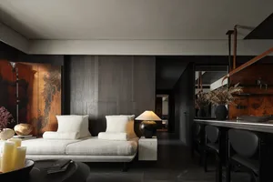 Modern living room with concrete and wooden furniture.