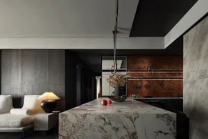 Kitchen with a marble countertop and contemporary design elements.