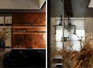 Modern kitchen interior with metallic accents and floating shelves.