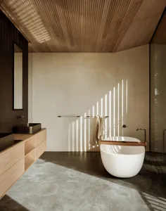 Modern minimalist bathroom with a free-standing oval tub, concrete floor, and wooden ceiling.
