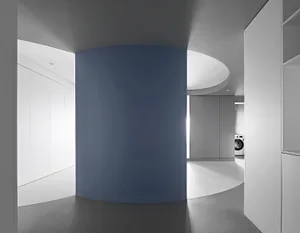 Modern, minimalist interior featuring a concrete column.