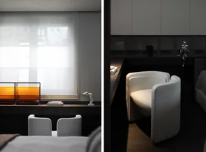 A modern interior featuring minimalist white furniture and sleek design elements.