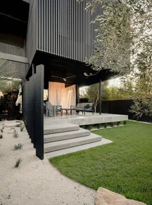 Modern style exterior design featuring a sleek, concrete structure with a minimalist aesthetic, showcasing clean lines and op