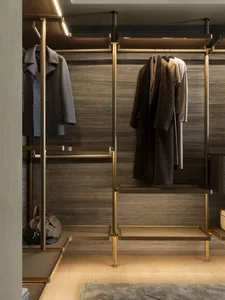 Modern wardrobe with metal and wood construction, featuring clothing and accessories.