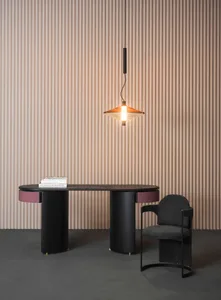 Minimalist office with a sleek, glass-top desk and a hanging lamp above.