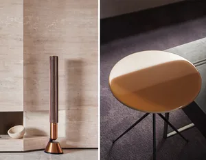 Modern, round side table with a sleek, metallic finish.