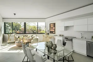 Modern residential kitchen designed with white materials.