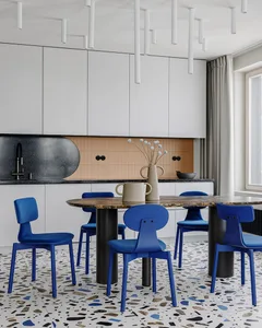 Modern kitchen featuring marble and terrazzo flooring.