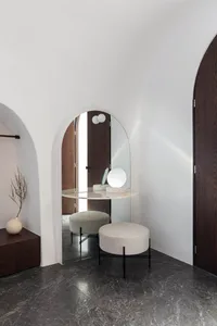 modern vanity room with a glass countertop and concrete countertop, featuring minimalist design