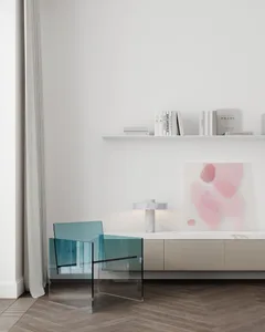 Minimalist living room featuring glass chairs, marble furniture, and a white wall with a shelf and abstract artwork.