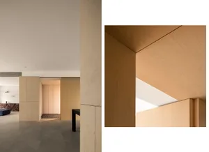 A minimalist interior design featuring wooden elements.