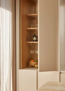 Modern kitchen featuring wooden shelves and marble storage