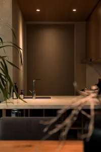 A modern kitchen with a granite countertop.