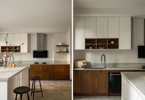 Modern kitchen with wooden cabinets, marble countertops, and stainless steel appliances.