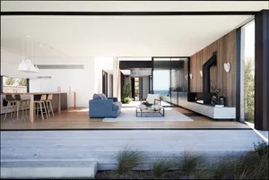 A modern living room featuring a wooden floor, a grey sofa, a white armchair, and a coffee table.