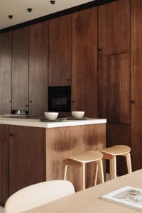 A contemporary kitchen featuring minimalist design principles and marble countertops.