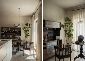 Modern residential kitchen and breakfast nook with wooden furniture, potted plants, and a cozy seating area.