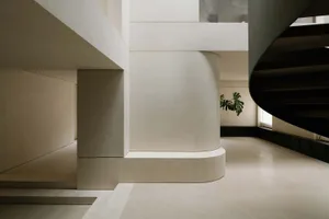 A modern interior space featuring concrete elements