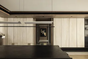 Modern dining room featuring wooden paneling and contemporary design elements.