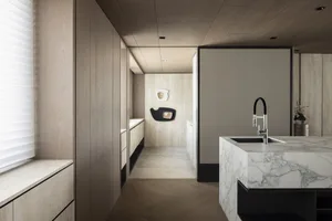 Modern minimalist kitchen featuring marble countertops and sleek, clean lines.