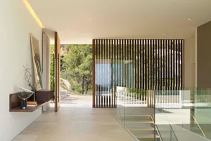 Contemporary interior design featuring glass window and minimalist decor.