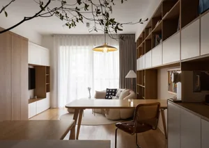 Modem living room with wooden flooring, white walls, and a fabric sofa.