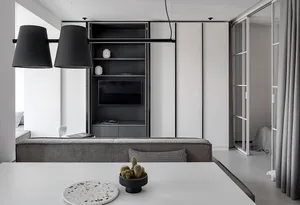 Modern living room with concrete furniture and minimalist design.