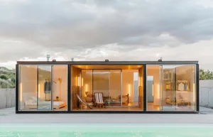 Modern minimalist residential house with a wood, glass, and concrete exterior.