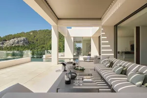 Modern patio featuring a concrete pool and outdoor seating.