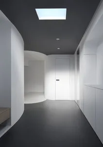 A minimalist space featuring white materials.