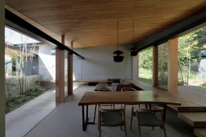 Modern living room featuring wooden furniture and walls.