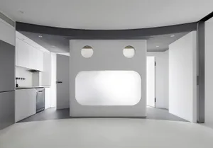 An image of a modern kitchen with white walls and minimalist design.