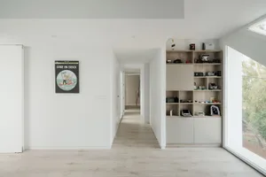 A minimalist residential interior with wooden elements