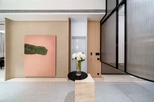 A modern interior space featuring a tile floor and minimalist design elements.
