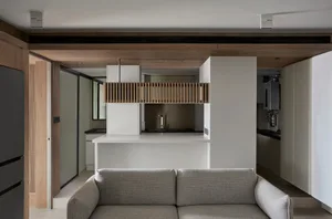 A modern residential kitchen with a white countertop and minimalist design.