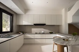 Modern kitchen featuring a minimalist design with concrete countertops and white cabinets.