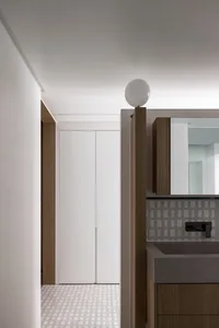 Minimalist bathroom featuring concrete countertops and wooden cabinets
