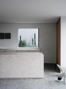 Modern minimalist interior with concrete and glass elements