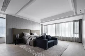 A modern minimalist bedroom featuring textured wall paneling