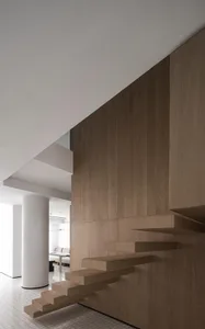 A modern floating staircase made of wood.